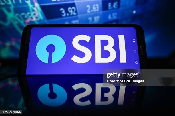 in-this-photo-illustration-a-sbi-logo-is-displayed-on-a-smartphone-with-stock-market814046389333192639.jpg